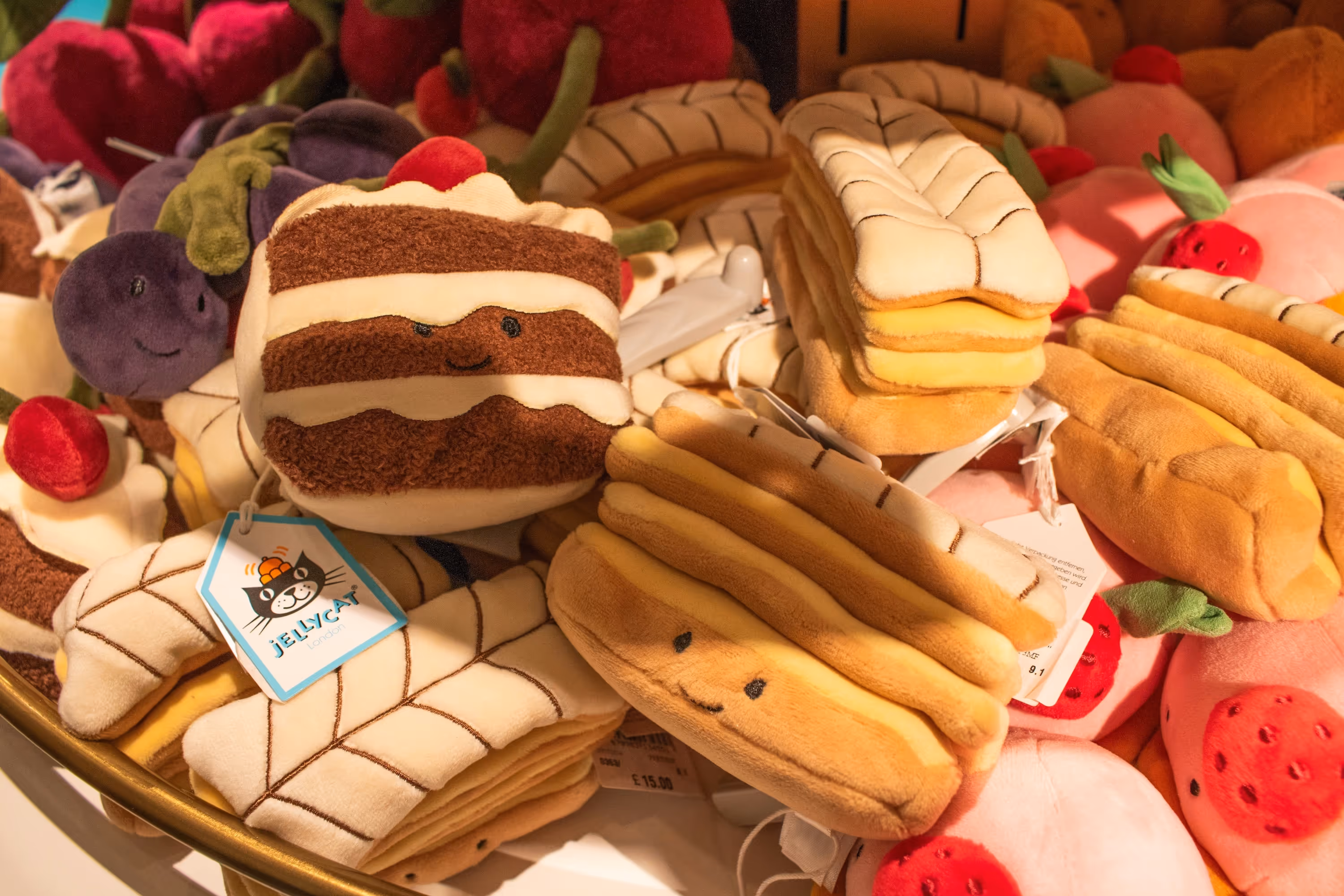A basket of jellycat dolls in different pastry themes